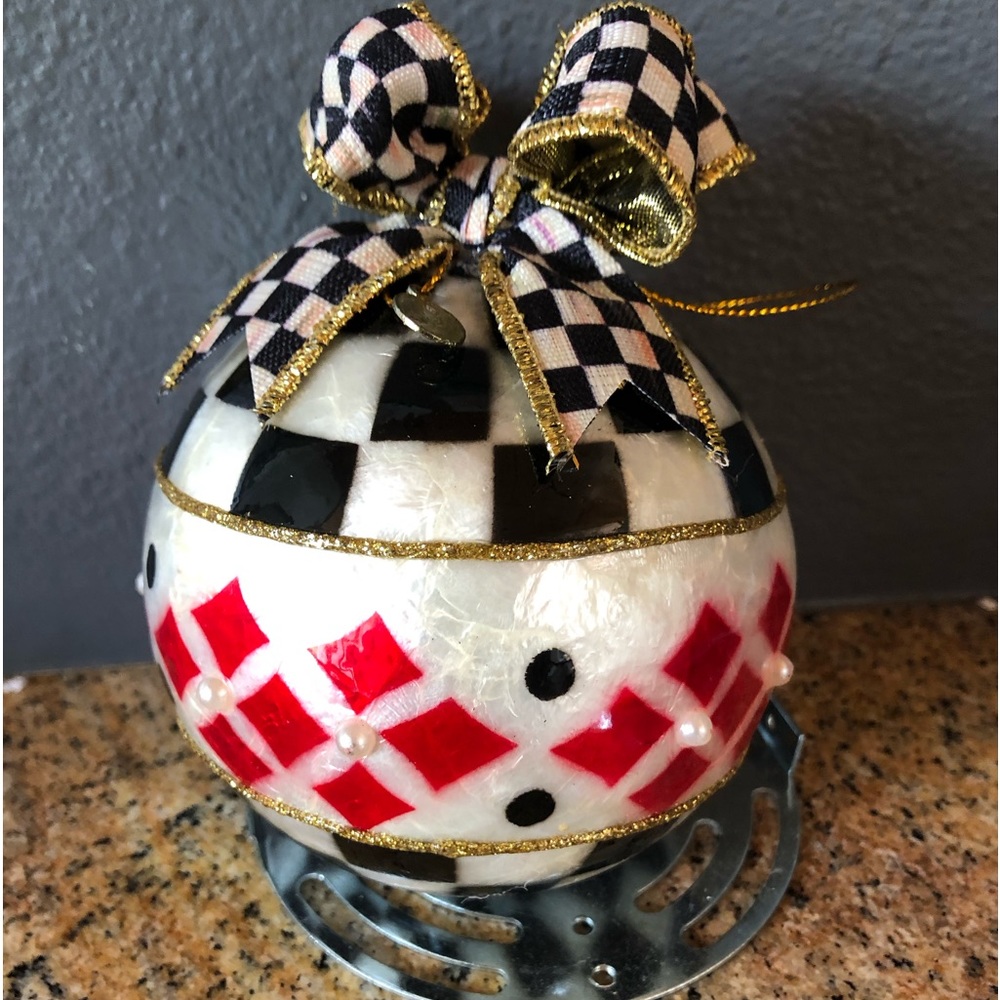 Mackenzie Childs black , red and white banded Capiz ornament